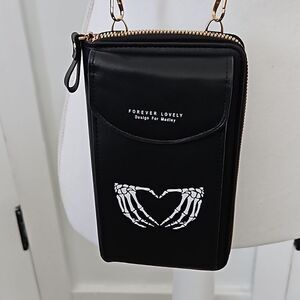NWOT Crossbody black handbag/wallet with skeleton hands